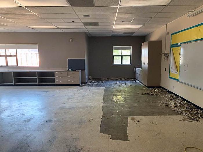 a classroom with flooring removed